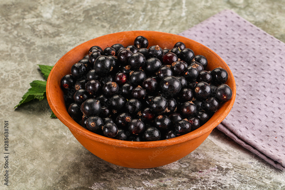 Ripe black currant in the bowl Ripe black currant in the bowl