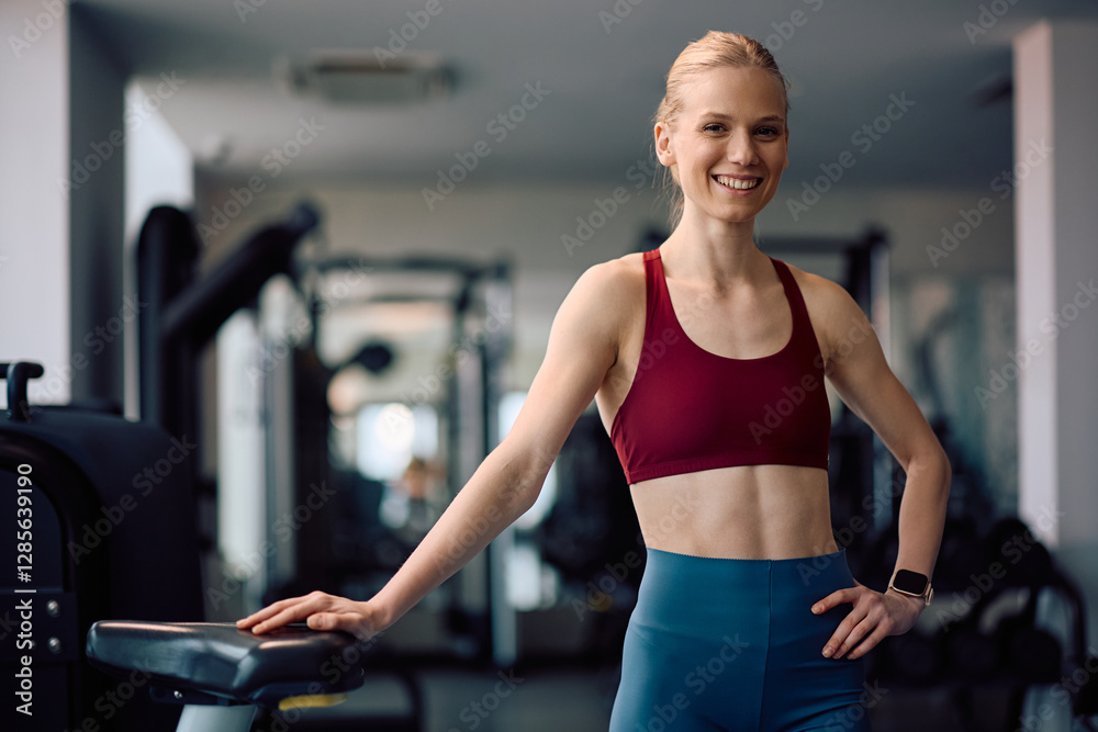 Portrait of happy athletic woman in gym looking at camera. Portrait of happy athletic woman in gym looking at camera.