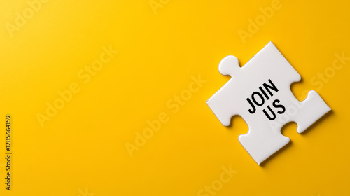 Isolated puzzle piece displaying join us text against vibrant yellow backdrop, symbolizing membership invitation and team connection