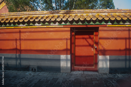 red wall with locked entrance door at Forbidden City Complex, Beijing, China. 