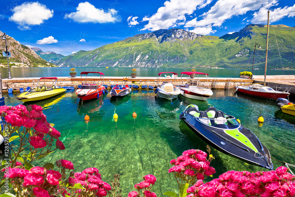 Speed boats on colorful Lago di Garda lake view,