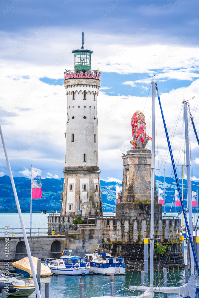 The famous harbor entrance of Lindau Bavarian Lion and New Lighthouse on Bodensee lake view