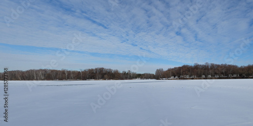 Winter fishing on the lake, beautiful panorama.