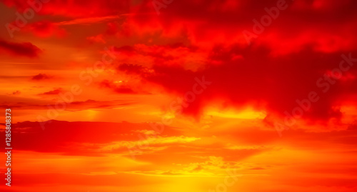 Dramatic fiery sunset red orange yellow gold abstract background. Warm glow. Burning flame energy. Vivid gradient