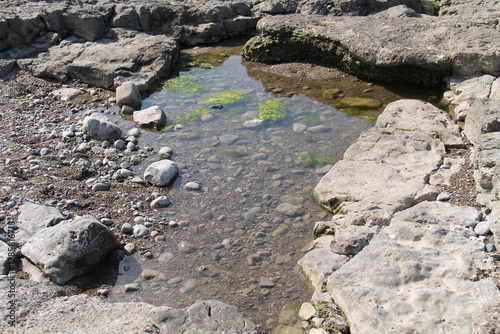 The Clear Water of a Seaside Beach Rock Pool. photo