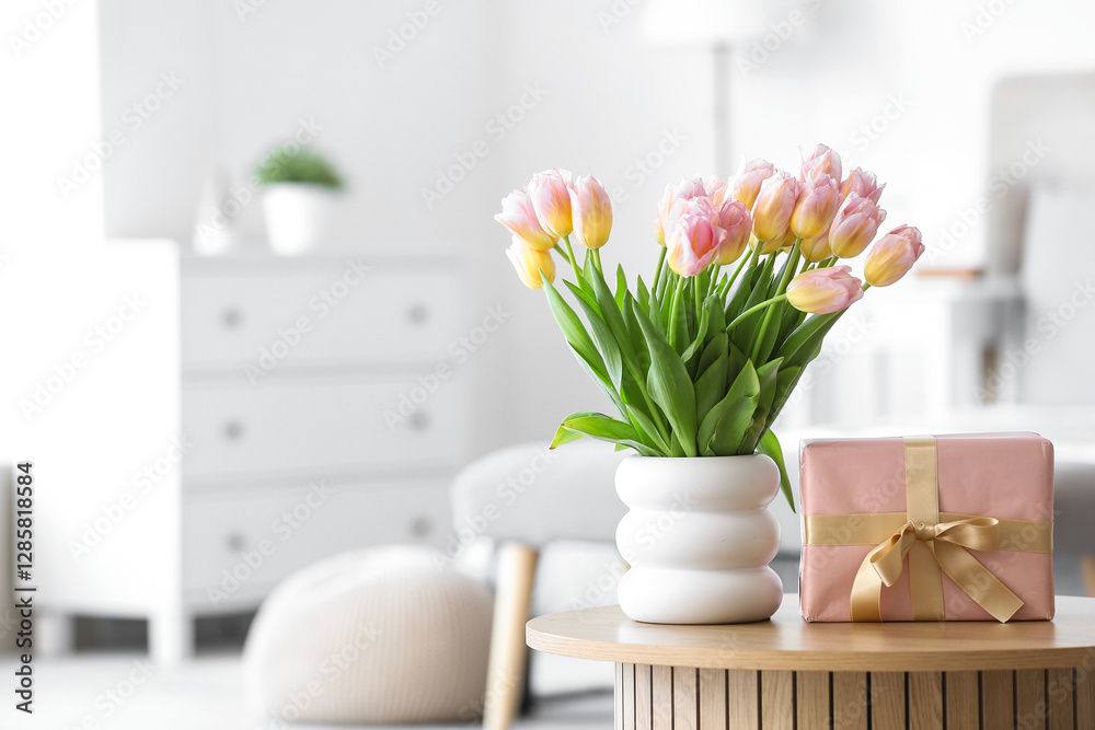 Εκτύπωση καμβά Vase with tulips and gift box for International Women's Day on table in bedroom