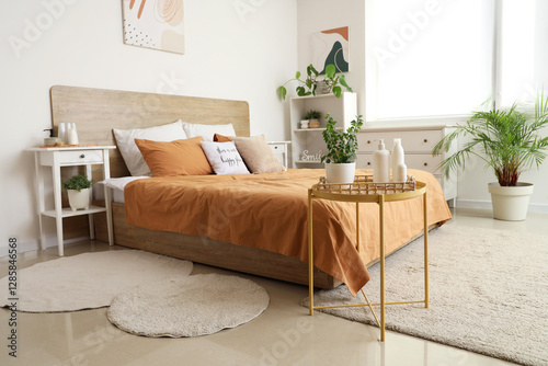 Interior of bedroom with ta...