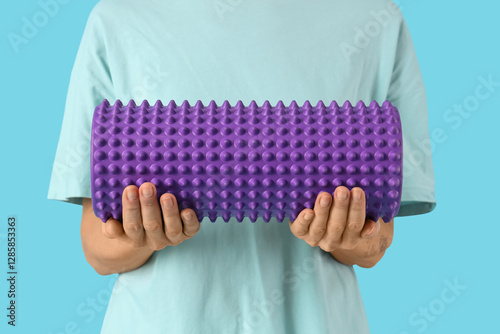 Person holding purple spiky...