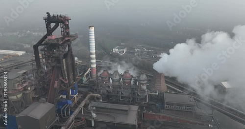 Schwelgern blast furnace, production of flat steel, heavy industrial site on misty day, fog, smog. photo