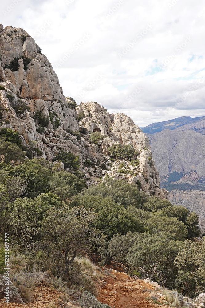 The mountain panorama opening from the hiking path to pick Puig Campana, Finestrat, Benidorm, Spain The mountain panorama opening from the hiking path to pick Puig Campana, Finestrat, Benidorm, Spain