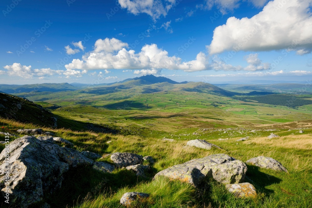 Fototapeta premium Scenic mountain landscape with green valley and blue sky, ideal for travel ads