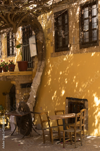 Fototapeta Naklejka Na Ścianę i Meble -  Shady taverna in old Chania, Crete