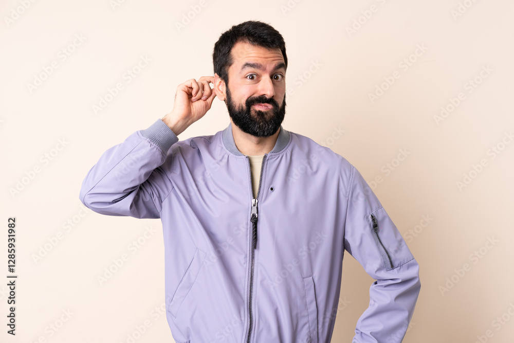 Caucasian man with beard wearing a jacket over isolated background having doubts Caucasian man with beard wearing a jacket over isolated background having doubts