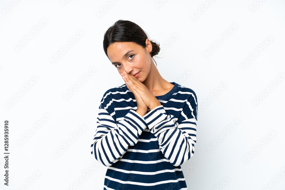 Young hispanic woman isolated on white background keeps palm together. Person asks for something Young hispanic woman isolated on white background keeps palm together. Person asks for something