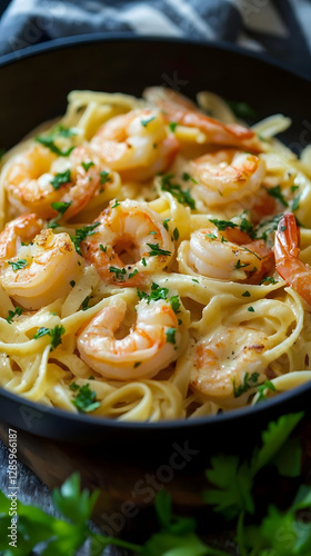 The photo shows all applicable creamy pasta with shrimp
