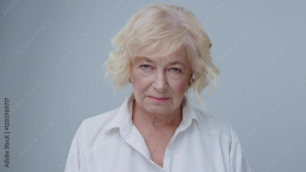 A contemplative senior woman is gracefully captured in soft light, embodying peace and serenity A contemplative senior woman is gracefully captured in soft light, embodying peace and serenity