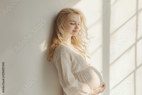 Young Pregnant blonde woman over isolated white background