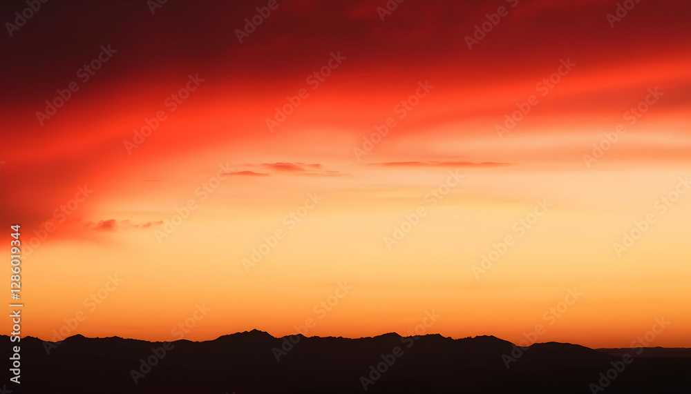 Obraz premium Fiery Sunset Over Silhouetted Mountains Dramatic Sky Landscape Photography