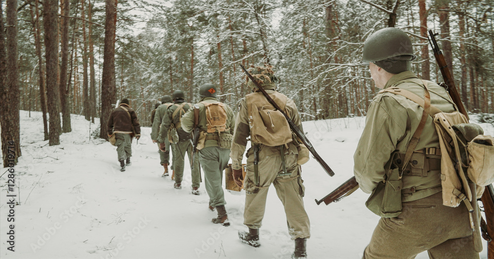 American Infantry Soldier Going Through Forest Road In Cold Winter Day. Usa Soldier Marching By Country Road. Usa Army Soldiers Of World War Ii. Heroes Of War