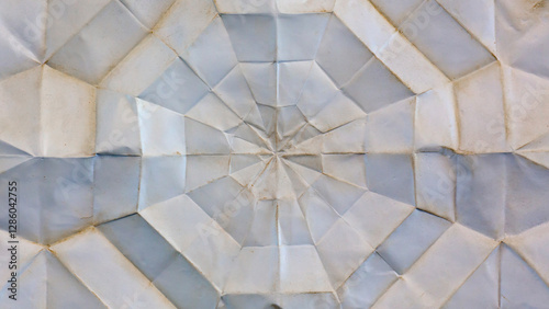 Geometric background texture made by folding and unfolding old paper