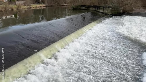 Water flows down a weir slow-motion