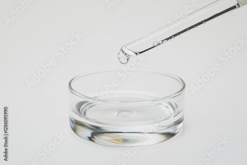 Droplet of liquid creating ripples in a dish captured in a studio setting during daylight. Generative AI