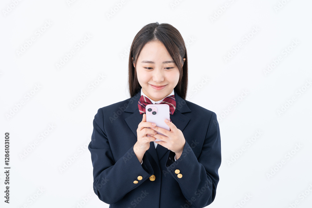 スマホを使う女子高生