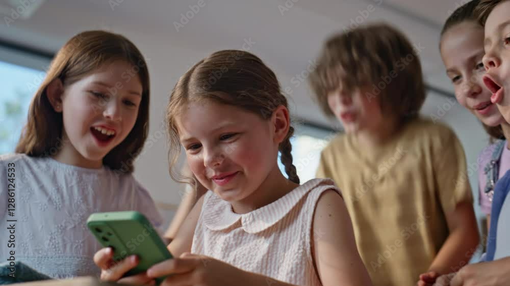 Smiling pupils browsing cellphone game enjoying break closeup. Happy schoolgirl Smiling pupils browsing cellphone game enjoying break closeup. Happy schoolgirl