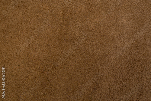 Genuine leather suede skin, textured surface, brown close up parchment structure , abstract backdrop