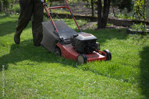 Lawn mover on green grass. Machine for cutting lawns.