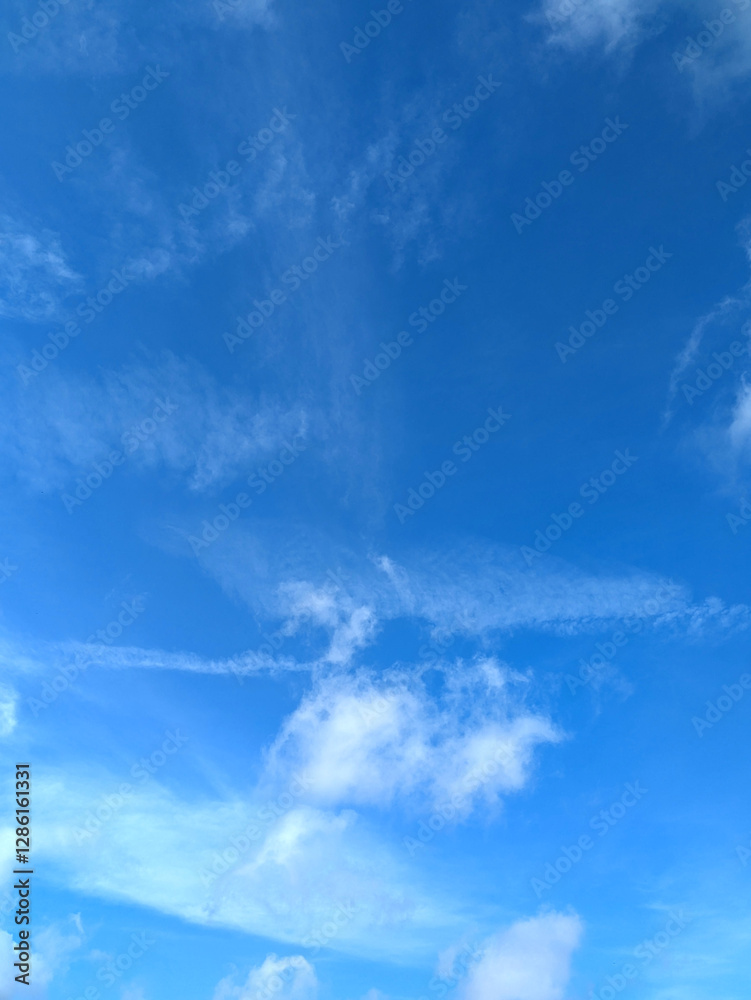 Bright Blue Sky and White Fluffy Clouds Whispy Skyline Bright Blue Sky and White Fluffy Clouds Whispy Skyline