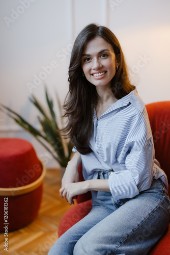 Company employee portrait. Smiling woman shot.