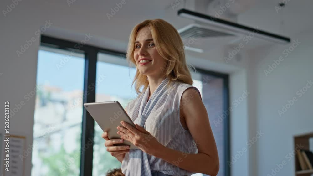 Positive teacher watching pupils writing in classroom closeup. Smiling woman Positive teacher watching pupils writing in classroom closeup. Smiling woman