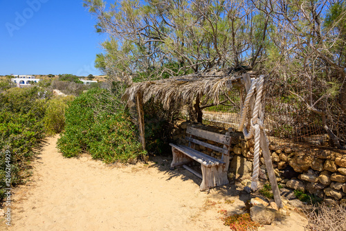 Obraz na płótnie A bench on the coastal path of Ano Koufonisi island. Small Cyclades, Greece w salonie