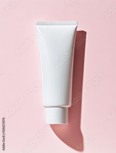 Wallpaper Mural Minimalist white tube on pink background, perfect for skincare or cosmetic products Torontodigital.ca