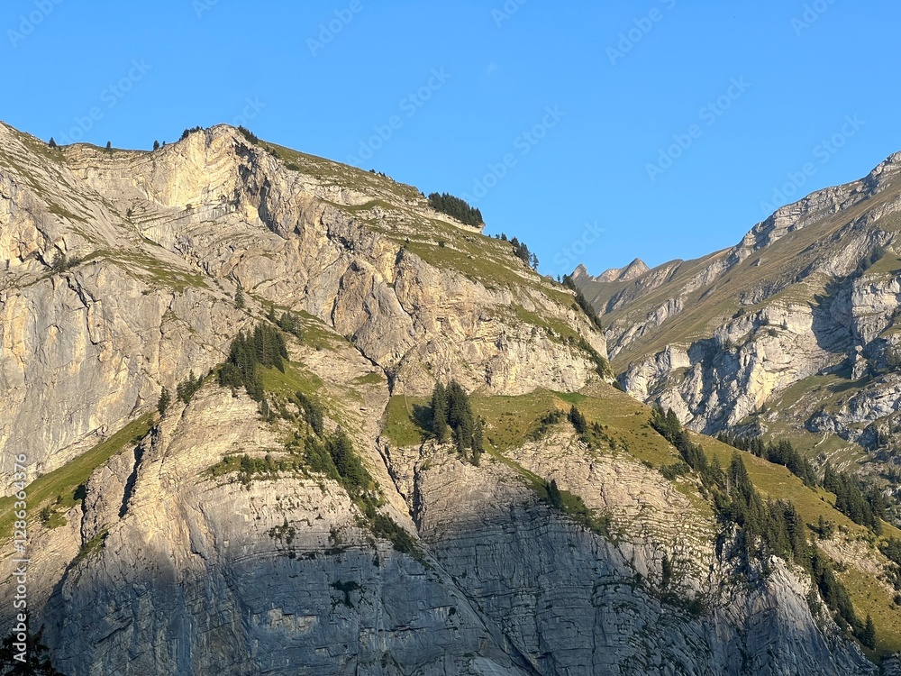 Obraz premium Rocky alpine peaks above Lake Melchsee or Melch Lake in the Uri Alps mountain massif, Kerns - Canton of Obwalden, Switzerland (Kanton Obwald, Schweiz)