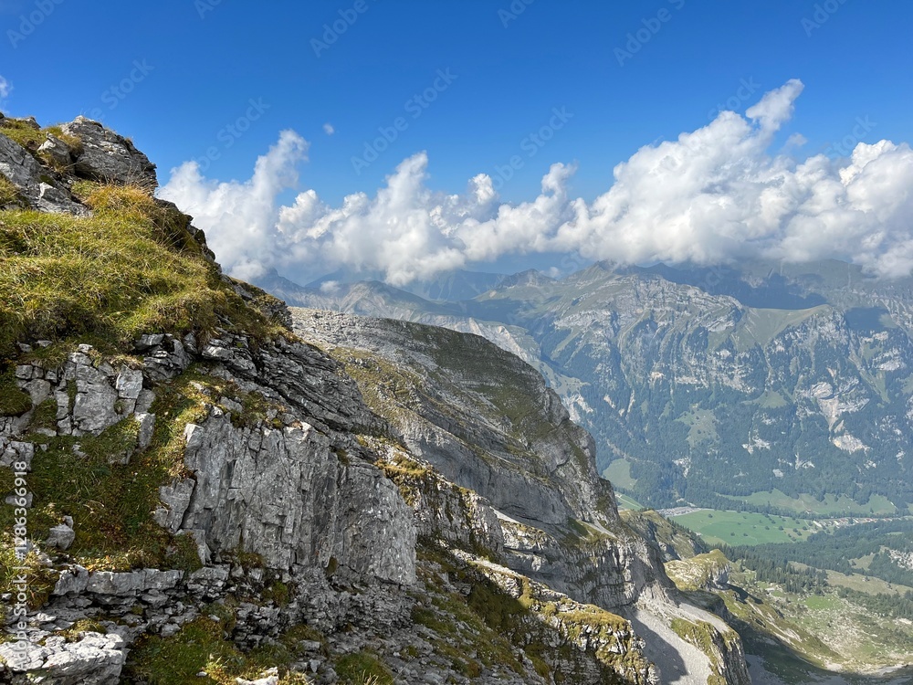 Obraz premium Rocky alpine peaks above Lake Melchsee or Melch Lake in the Uri Alps mountain massif, Kerns - Canton of Obwalden, Switzerland (Kanton Obwald, Schweiz)