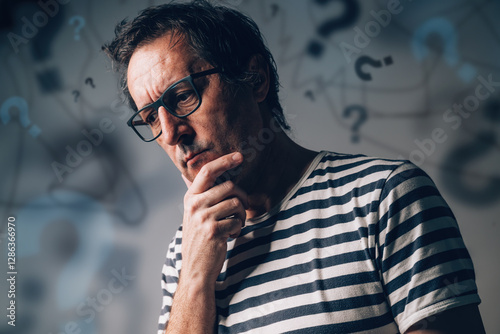 Overthinking and overanalyzing or analysis paralysis concept, perplexed anxious man