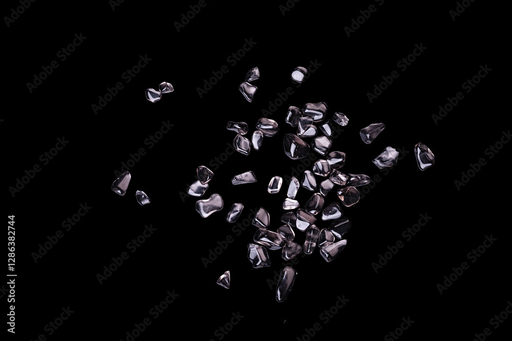 gravel chips Polished smoked quartz stacks top view isolated on black background gravel chips Polished smoked quartz stacks top view isolated on black background