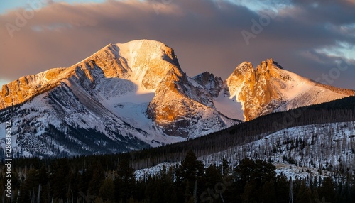 a snow capped longs peak mountain morning