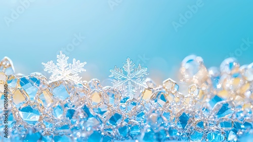Winter background with snowflakes and copy space. Ice crystals on blue background for festive design.