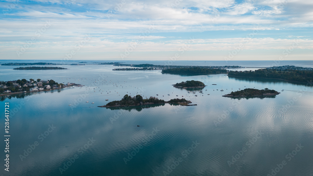 Aerial view of small islands in a calm bay with sailboats, Cape Cod, USA. Aerial view of small islands in a calm bay with sailboats, Cape Cod, USA.
