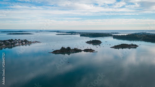 Aerial view of small islands in a calm bay with sailboats, Cape Cod, USA.