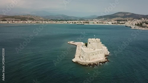 Exploring the historic fortress on the small island in the serene bay near the coastal town
