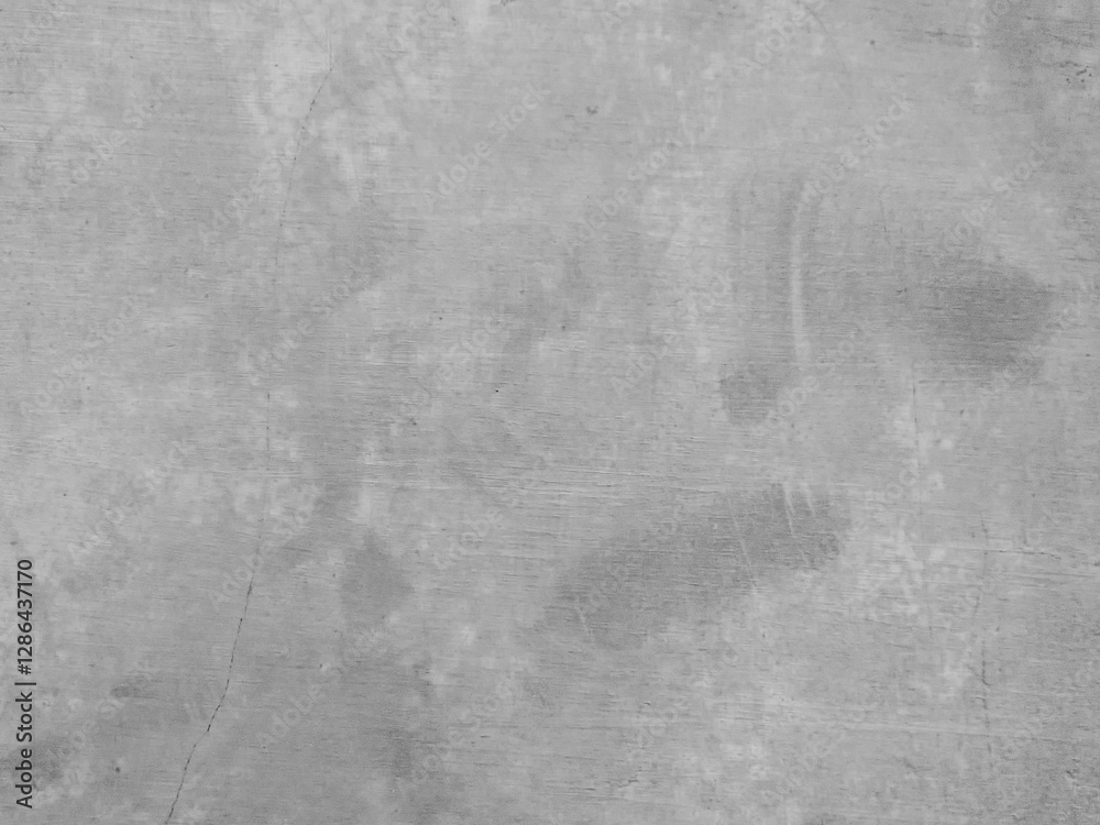 Naklejka premium Smooth wall surface with faint lines and subtle variations in gray tones.