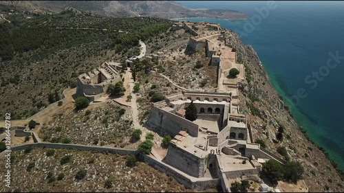 Exploring a historic coastal fortress on a sunny day with breathtaking views of the sea and landscape