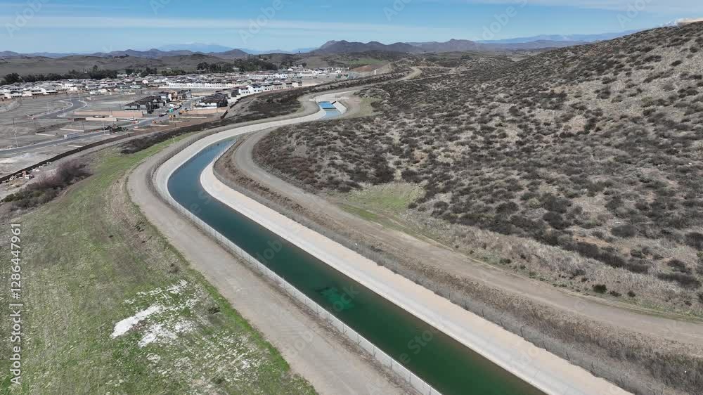 Slow Dramatic Aerial Drone Flight Over Water Flowing Through Aqueduct Slow Dramatic Aerial Drone Flight Over Water Flowing Through Aqueduct