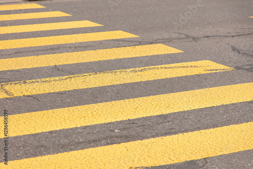 Pedestrian crossing, yellow color stripes crosswalk, closeup