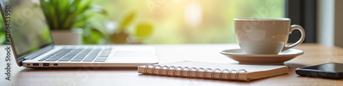 LinkedIn background with laptop, cup with coffee and note book. Business office concept.