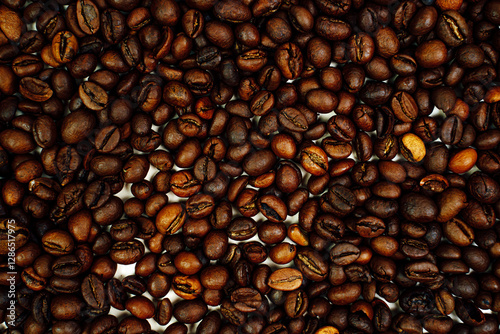 Coffee beans on a white background. Close-up. Space for text